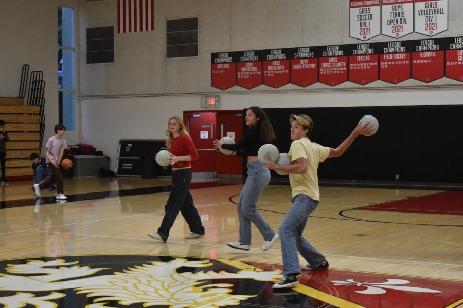 DODGE, DUCK, DIP, DIVE AND DODGE: Students on the team “Gotta Dodgethemall” prepare to throw balls at competitors on the opposing team “Baldwin N the Boys” in Taper Gym during a semifinals match which occurred Dec. 9. “Gotta Dodgethemall” lost 2-0.