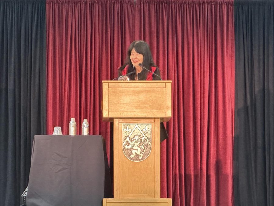 Joy Harjo, the Brown Family Speaker, speaks to students at an assembly. 