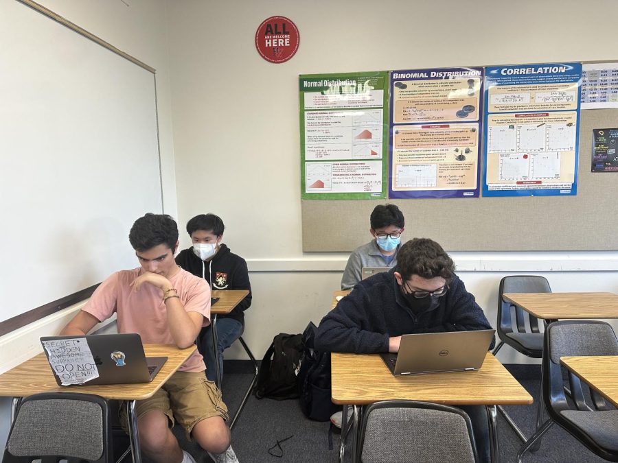 Jacob Massey ’25, Elliot Lichtman ’23, Hugh Cheng ’25 and Sophomore Prefect Eric Lee ’25 take the new unified course survey on their laptops, allowing them to give feedback on their teachers. 