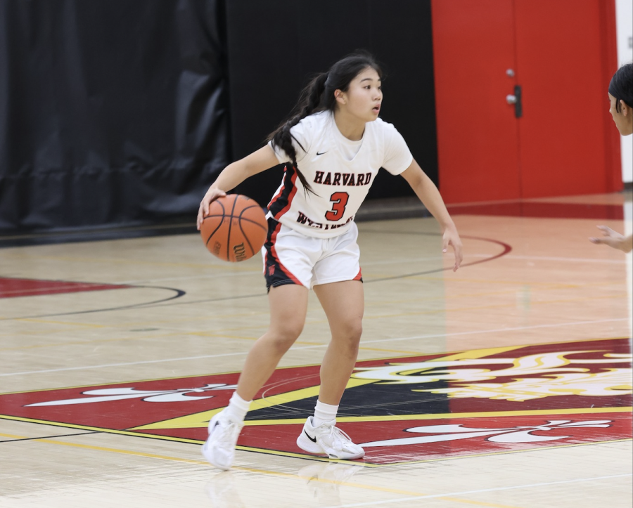 Calling the Shots: Point Guard Jamie Yue 24 looks to a teammate for a pass as she tries to get past a defender. The girls basketball team is currently 5-5 in league and 18-10 overall as it heads into the playoffs.