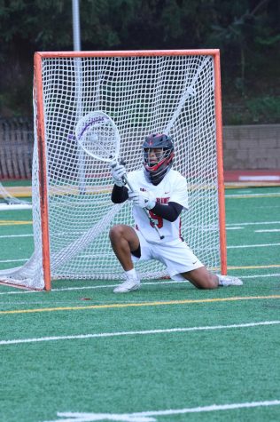 SAVING THE DAY: Goalie Rohan Mehta ’23 saves a shot on goal versus Palisades High School April 12. The team also celebrated Senior Night. Printed with permission of Darlene Bible.