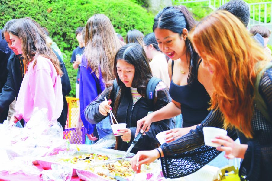 Booths at the Multicultural Fair served various cultural delicacies to students on the Quad. Booths also included music and games, and members of several SLIDE groups gave instrumental and dance performances for members of the school community. 