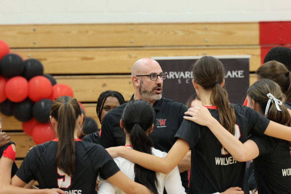 Girls+volleyball+program+head+Mitchell+Kalick+huddles+with+the+team+in+a+game+against+Notre+Dame+Academy+Oct.+5.