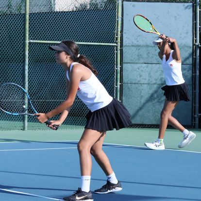 Aryadini Diggavi 25 and McKenzie Henry 27 play doubles in a match against Archer.