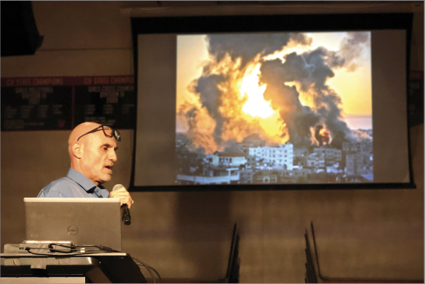 History teacher Dror Yaron speaks at a mandatory assembly for students Oct. 23. The presentations were meant to teach students about the broader history behind the Israel-Palestine conflict amid the Oct. 7 attack on Israel by the Palestinian militant group Hamas. 