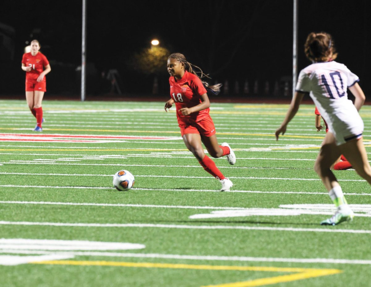 Striker Vicky Pugh 25, who is committed to play Division 1 Womens soccer at Vanderbilt University, looks to make a pass during a game against Chaminade High School on Jan. 18.