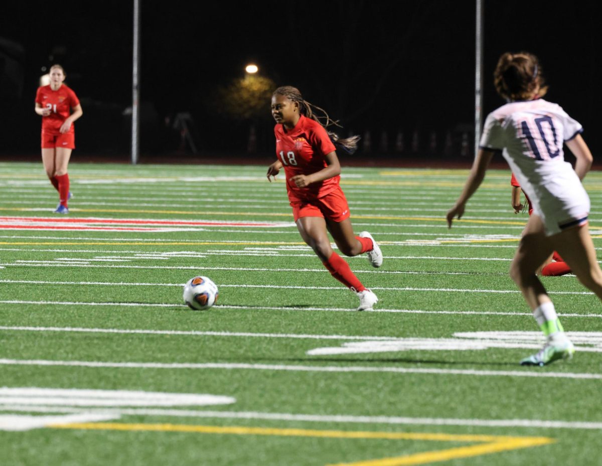 Striker Vicky Pugh ’25, who is committed to play Division 1 Women’s soccer at Vanderbilt University, looks to make a pass in a game against Chaminade High School on Jan. 18.
