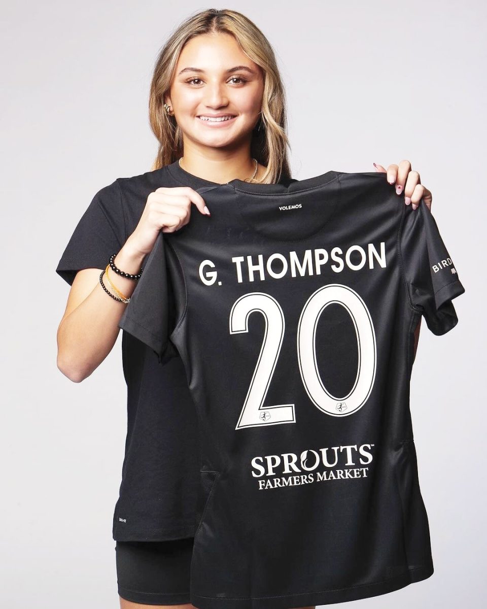 Gisele Thompson 24 poses for a photo shoot with her new jersey following a historic three-year contract with Angel City FC, a Los-Angeles-based soccer club, joining her sister Alyssa Thompson 23.