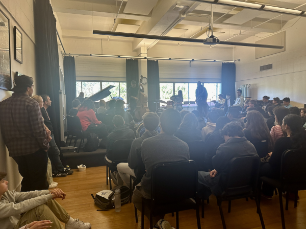 Students and faculty gather in the Chalmers performing arts room Dec. 14 for the fourth lunch concert of the year. Parents provided refreshments and invited professionals played multiple sets.