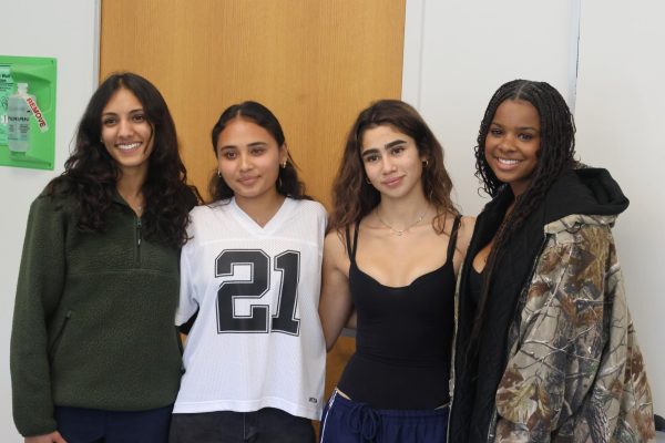 From left to right, Women of Color Club leader Nicola Dadlani 25, girls soccer alumnus and USWNT member Alyssa Thompson 23 and club leaders Eva Vaca 24 and Bronwyn Vance 24 stand together for a photo after Thompsons visit.