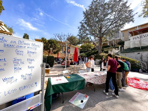 Environmental Club members engage with students in their setup on the Quad. Throughout War on Waste Week, they raised awareness about plastic waste on campus.