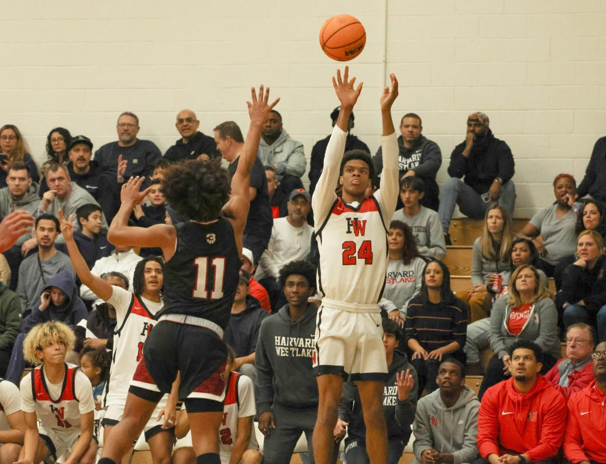 Forward Isaiah Carroll 25 shoots a three from the left corner in a playoff game against Corona Centennial. They would defeat the Huskies 61-51 to advance to 1-0 in CIF Open Division pool play.