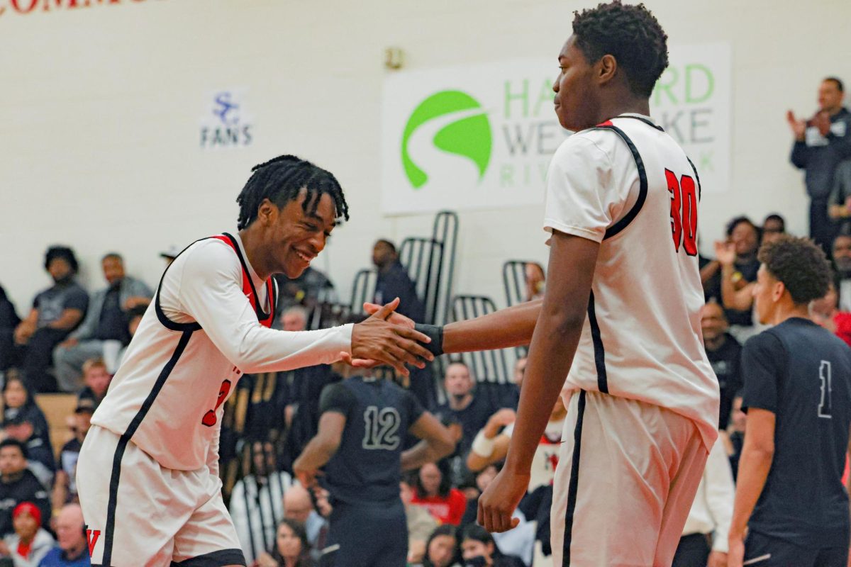 Sophomores Amir Jones 26 and Dom Bentho 26 celebrate in a CIF-SS group play matchup against Sierra Canyon.