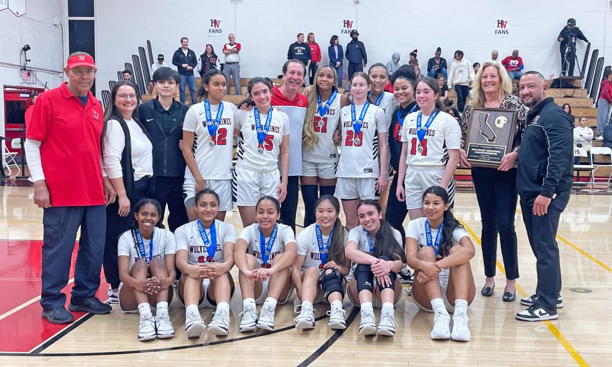 The girls basketball team poses with medals and a plaque from their win over Notre Dame on Tuesday Night. This will be the programs first time advancing to the CIF State Championship since 2010, which they won that year.