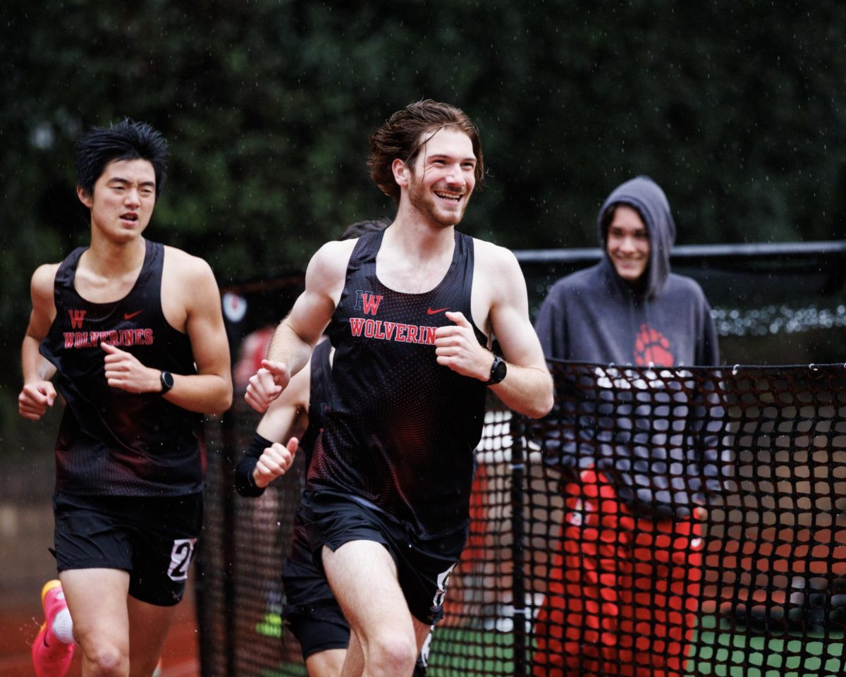 Seniors+Nuzzy+Sykes+24+and+Chris+Weng+24+run+in+a+track+event+at+Ted+Slavin+Field.
