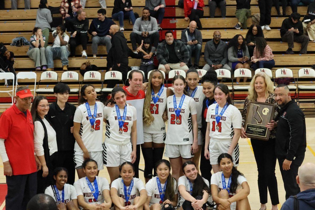 The+girls+basketball+team+poses+with+medals+and+a+plaque+from+their+win+over+Notre+Dame+on+Tuesday+Night.+This+will+be+the+programs+first+time+advancing+to+the+CIF+State+Championship+since+2010%2C+which+they+won+that+year.