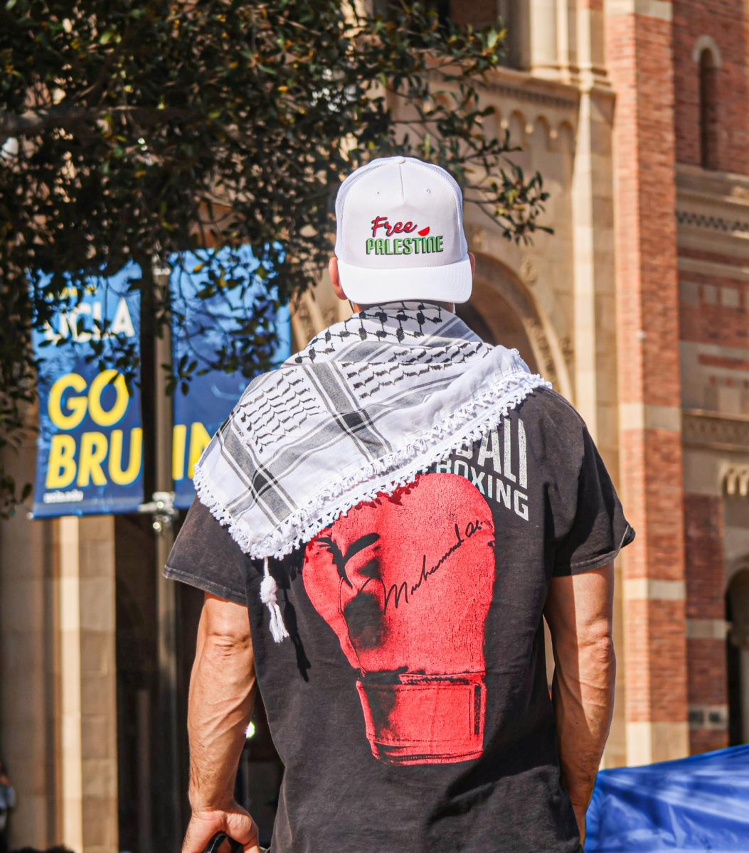 A protester stands near Dickson Plaza at the University of California, Los Angeles (UCLA), where students and external supporters set up a pro-Palestinian encampment. The University of California Police Department and the Los Angeles Police Department forcibly disbanded the encampment after there was a violent confrontation.