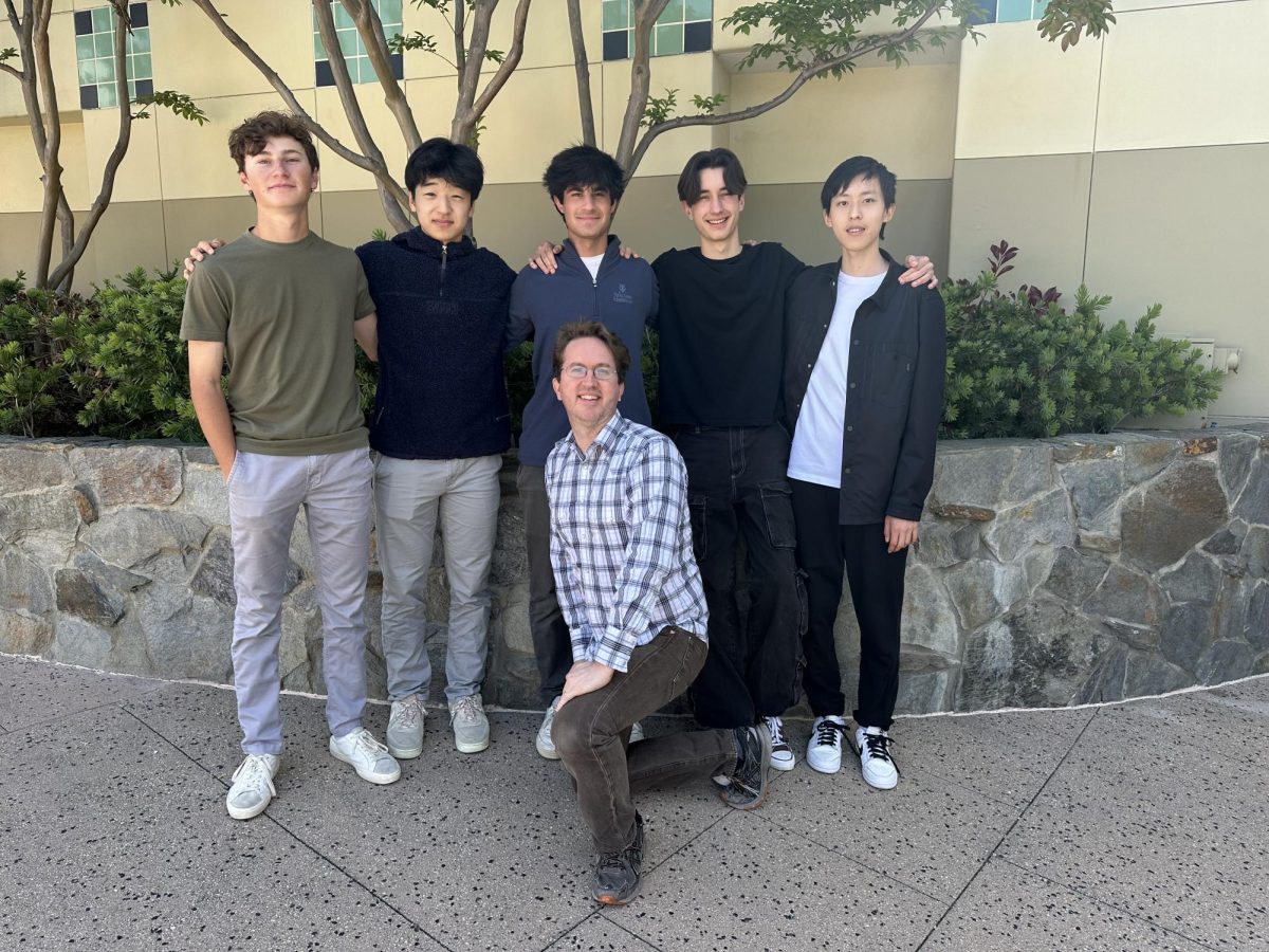 From left to right: Mason Wetzstein 25, Ethan Seung 25, Ryder Katz 25, Michael Barr 25 and John Xu 25 stand together with their faculty advisor Andy Stout.