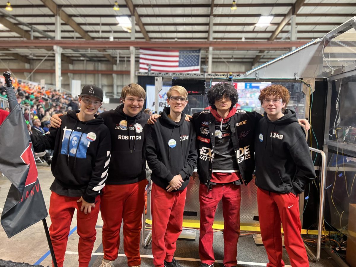 Members of Team 1148 pose for a photo at a tournament.