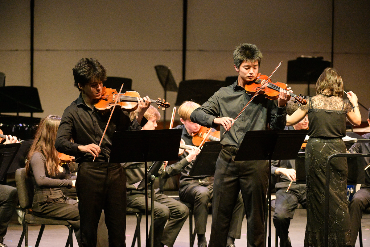 Students perform at Performing Arts Festival. To commemorate Orchestra Director Mark Hilts last concert, Hilt joined students on stage for a final piece.