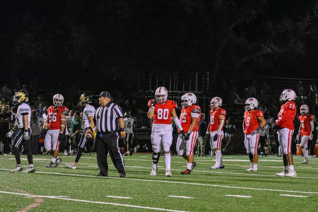 The defense lines up in a game against Royal High school Sept. 14. Kurtis Walter '27 and Dylan Fullmer '27 each had key interceptions for the Wolverines.