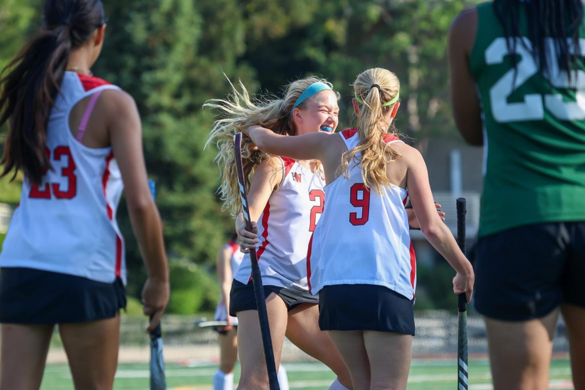 Attackers Margaux Schlumberger '27 and Abby Ryan '27 celebrate together after a goal.