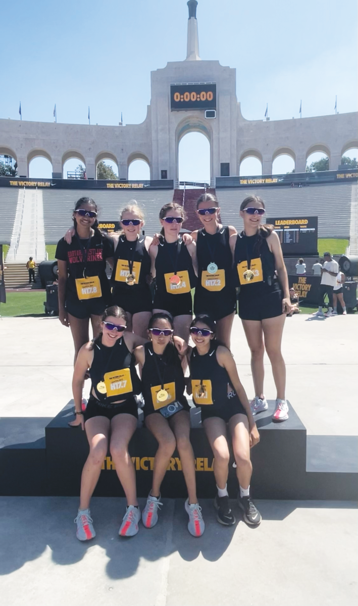 The girls’ cross country team members pose at the LA Memorial Coliseum after completing a half-marathon Aug. 24.