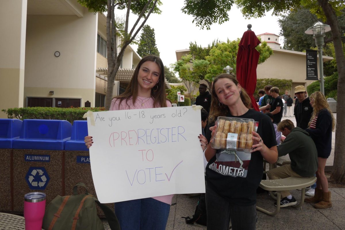 Club leaders Amelia Chiarelli '25 and Rheanna Vradiy '25 stand together in the Quad. They both organized the booth for students to register.