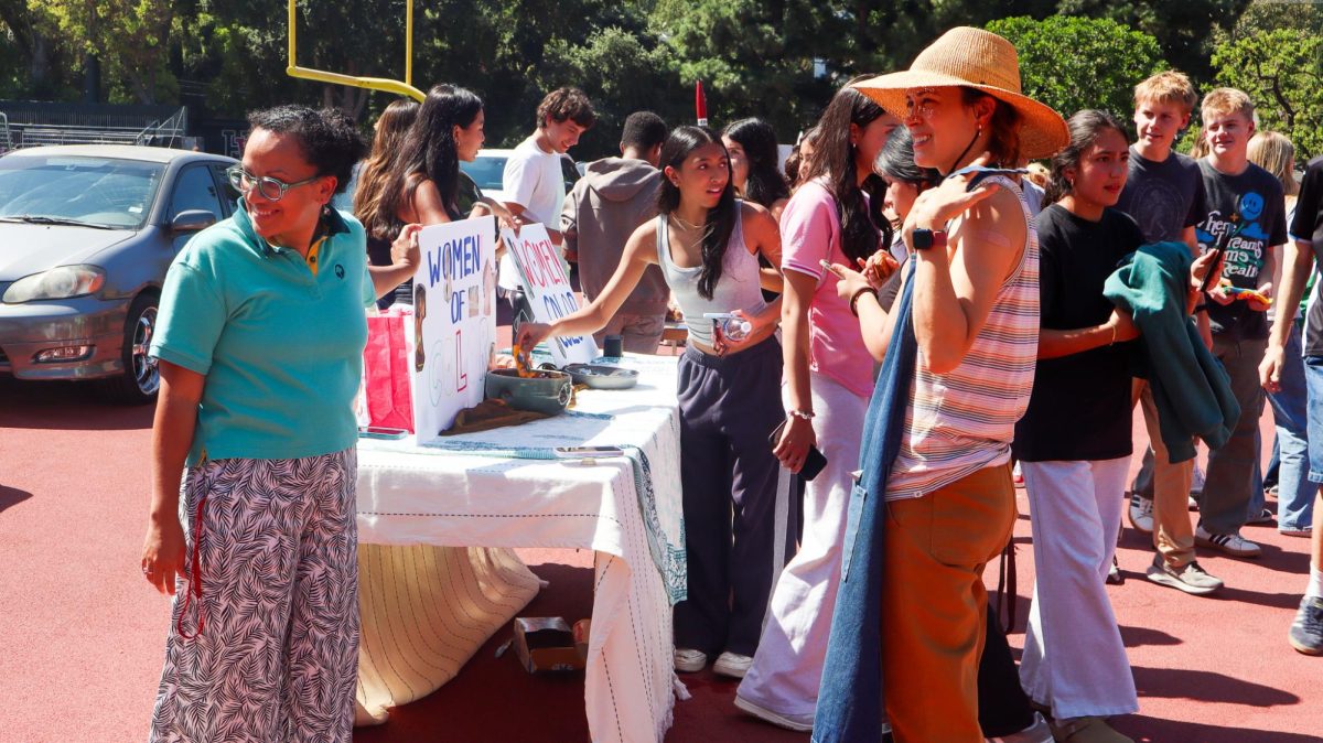 Students and faculty browse student-run clubs at the fair.