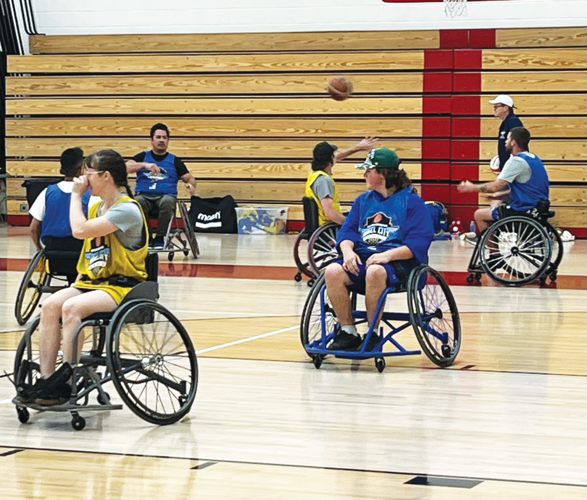 Paralympic athletes visiting the school play against each other in a game of wheelchair basketball in Taper Gymnasium.