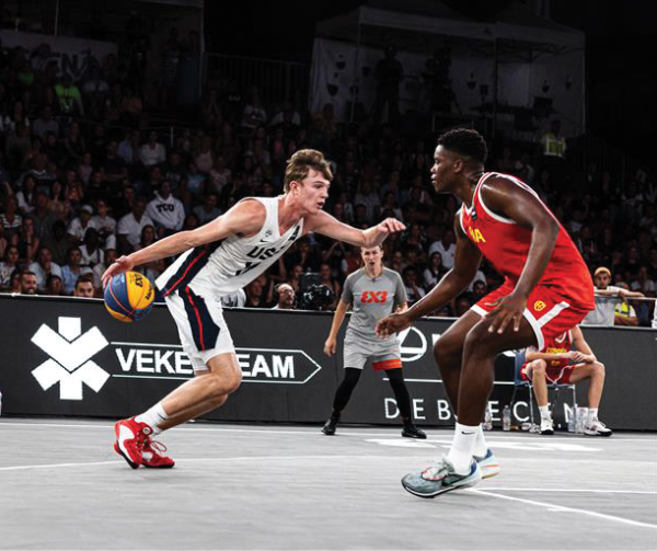 Nikolas Khamenia dribbles the ball in the gold medal match against Spain. Khamenia led the team with nine points to win the FIBA U18 3x3 World Cup.