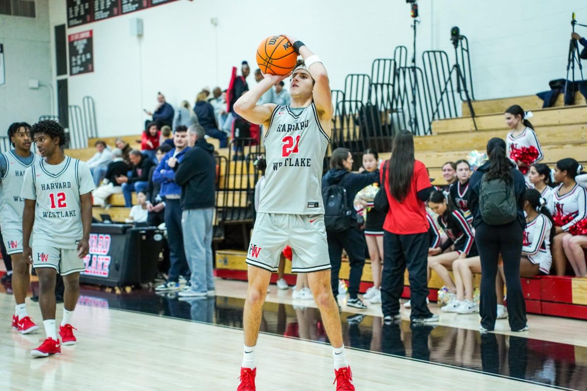 Guard Joe Sterling '26 shoots a three-pointer. The new transfer led the team with 25 points in the team's home-opener of the 2024-2025 season.