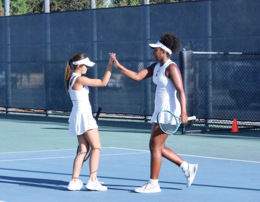 SERVE AND PROTECT: With another win, the girls’ tennis team enters the tournament with an 8-0 league