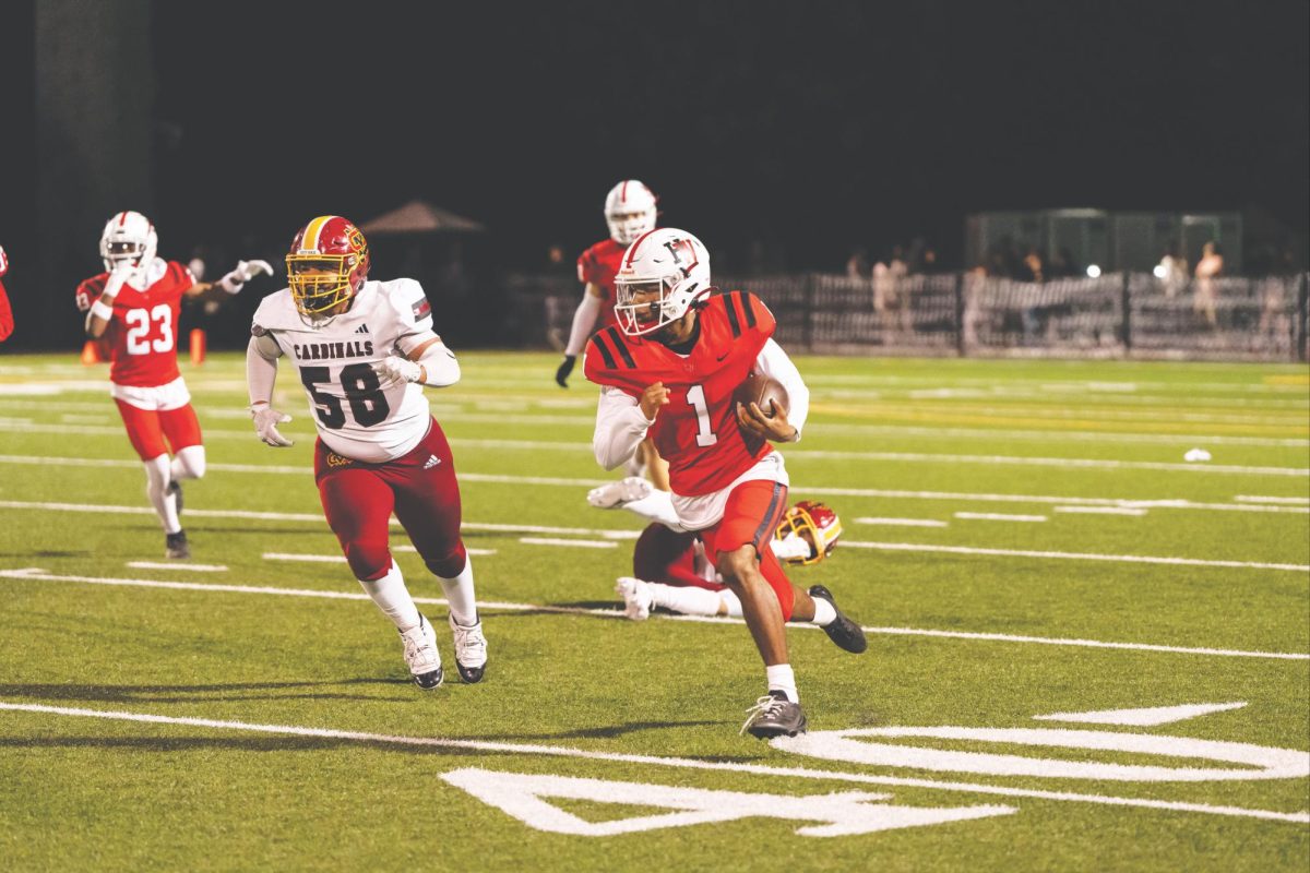 Quarterback Aaryan Mehdi Williams ’27 accelerates past defenders during the homecoming game against Cantwell-Sacred Heart of Mary High School. Mehdi Williams played for the first time since tearing his miniscus during his second game of the season.