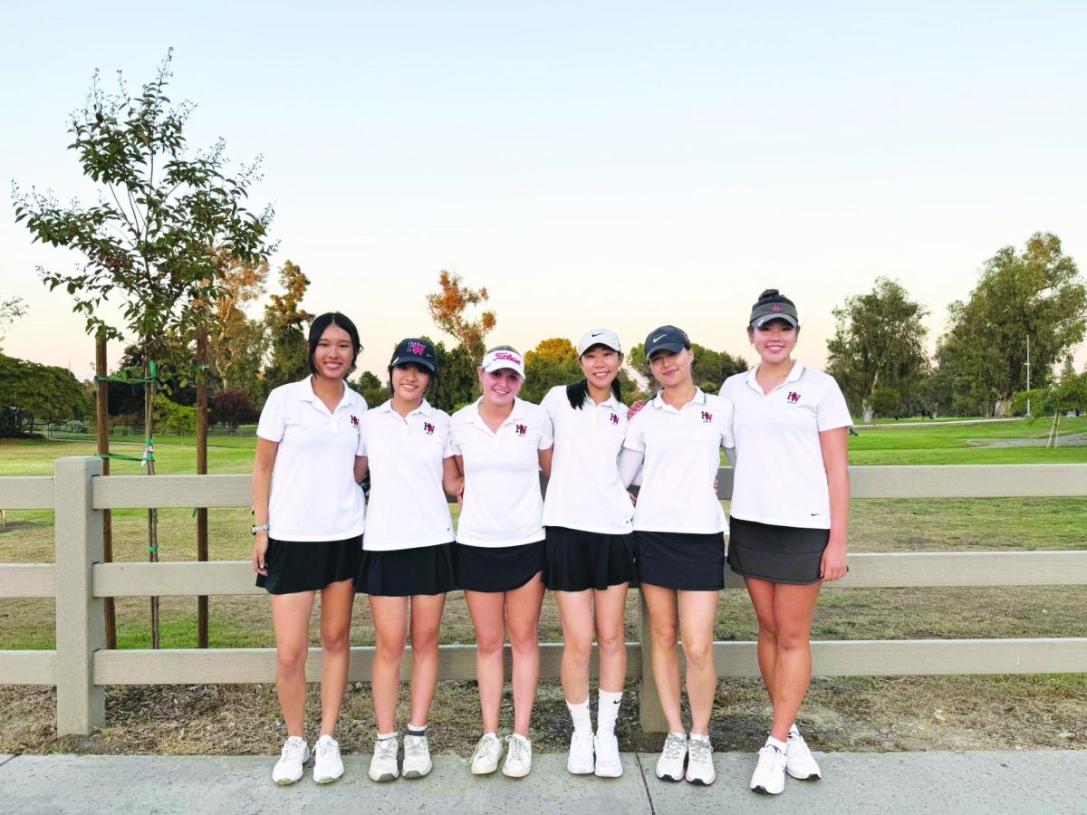 The girls’ golf team celebrates with a team photo after victory against Marymount, wrapping up their season on a high note.