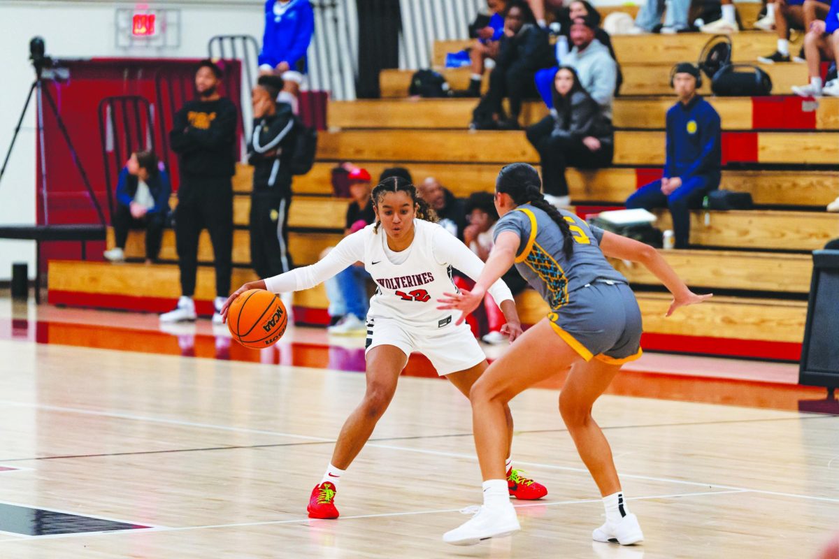 Guard Madison Gillette ’26 maintains control as she drives past her defender during a home game. Gillette helped the team secure another season victory against Francis Parker High School.