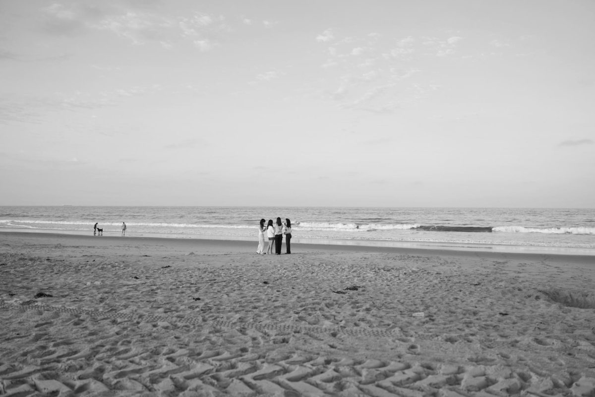 A group of seniors pose on the beach together to celebrate the last day of summer and the start of an exciting senior year.