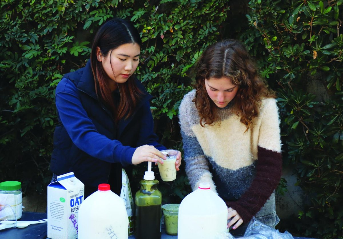 MEDLIFE leaders Lina Wu ’28 (left) and Charlotte Conrad ’28 (right) prepare an oat milk matcha latte to sell in their fundraiser happening on the Quad during lunch. All profits from the matcha latte sales are to be donated to the Children’s Hospital of Los Angeles. 