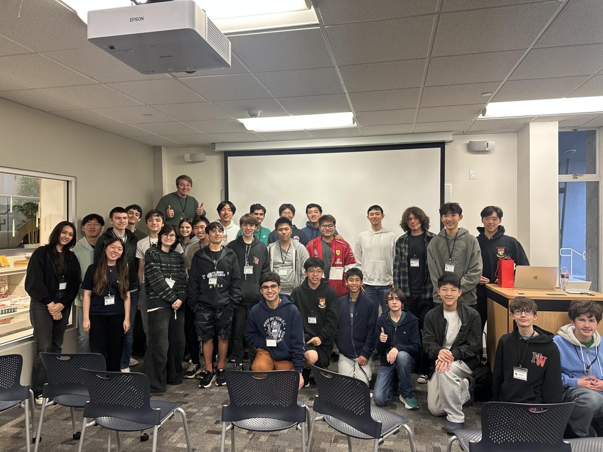 PLAY MODE ON: HackHW participants pose together after a weekend spent turning ideas into interactive worlds. Middle and Upper School students teamed up in Mudd Library to brainstorm, design and ultimately build original games during the club’s annual overnight coding challenge.